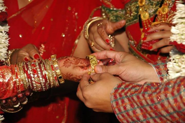 Subash Maharjan Putting Bangel on Shilpa Suwal's Hand during Wedding